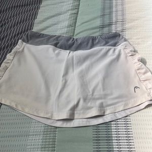Head short skirt with built in athletic shorts size small
